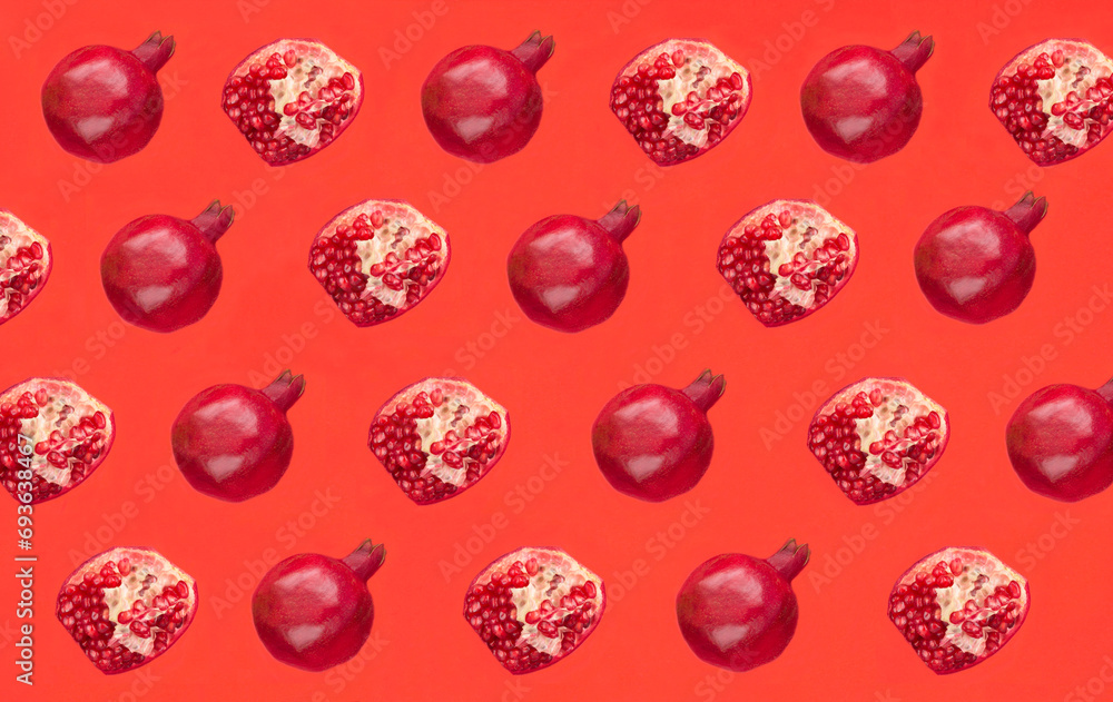 Pomegranate on the red background.Pattern. Flat lay. Top view. Pomegranate on the red background.Pattern. Flat lay. Top view.