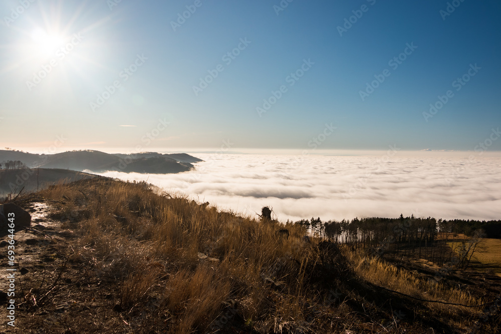 On a hill above the clouds