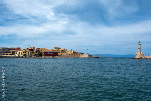 Crete Greece. Lighthouse, beacon at Venetian harbour in Old Town of Chania. Sunny day