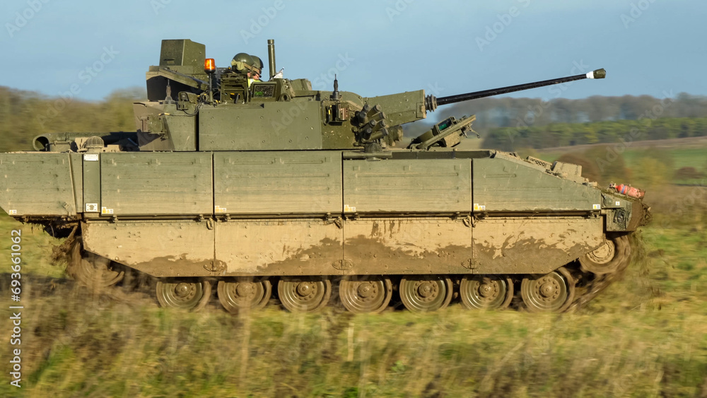 British army General Dynamics Ajax Reconnaissance and Strike armoured fighting vehicle (AFV), tank in action. Wilts UK British army General Dynamics Ajax Reconnaissance and Strike armoured fighting vehicle (AFV), tank in action. Wilts UK