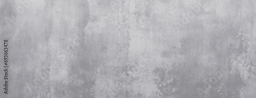 Abstract Concrete Wall with Textured Finish. A wide, high-resolution image of a concrete wall featuring a blend of textures and shades of gray photo