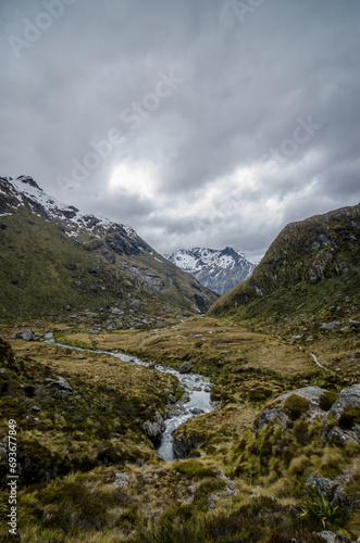 Mountain river passing through a valley in New Zealand. This photo was taken on a hike on Routeburn track.