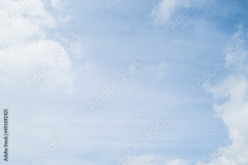 hazy blue sky with clouds