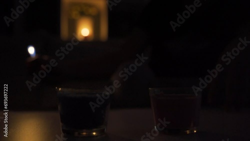 Lighting candle, dark house. photo