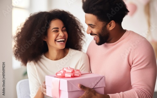 Young couple with gifts for...