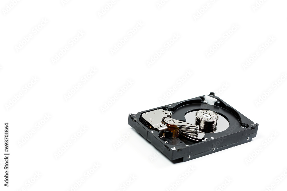 Disassembled hard drive on a white background, hard drive repair Disassembled hard drive on a white background, hard drive repair