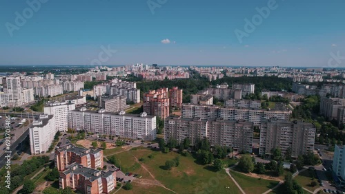 Aerial view of a residential microdistrict with large parking lots for cars and green recreation areas photo