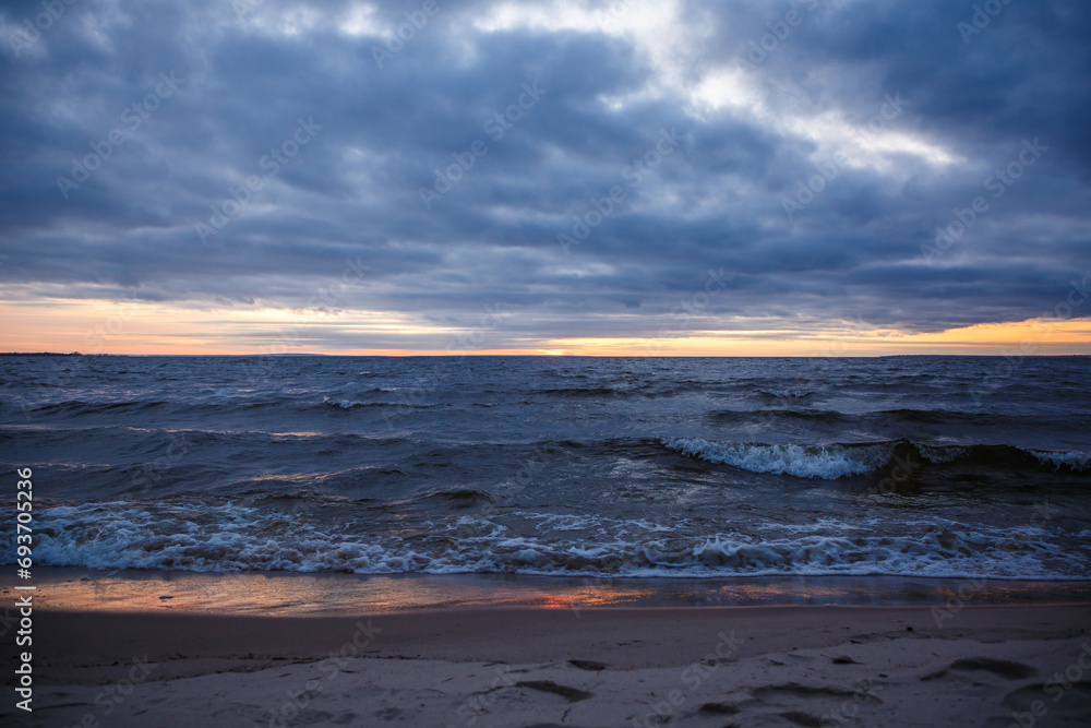 Cloudy sunset on the seashore, beautiful sunset by the sea Cloudy sunset on the seashore, beautiful sunset by the sea