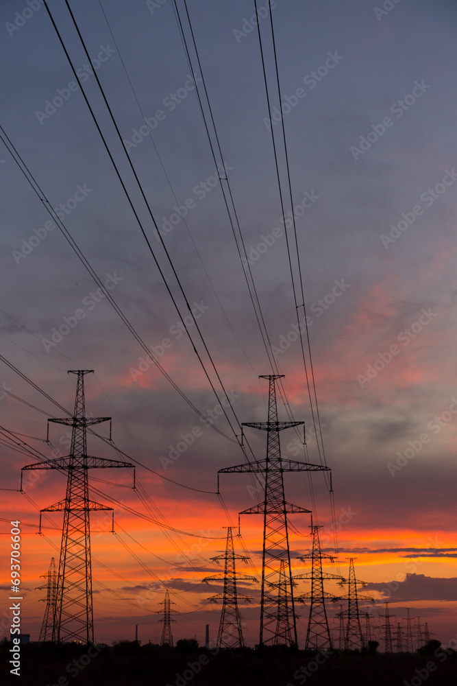 Orange sunset and power lines, high voltage power line