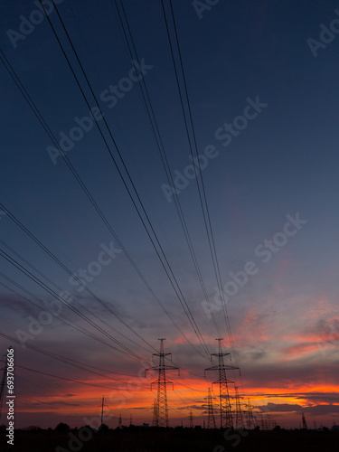 Orange sunset and power lines, high voltage power line