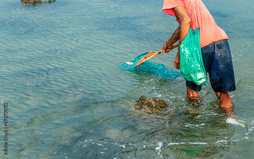 People catch fish that float on the surface of the water because they are poisoned by the roots of the tuba plant or Derris. environmental problems