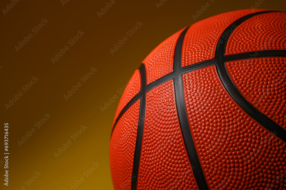 Fototapeta premium Basketball ball on color background, closeup. Space for text