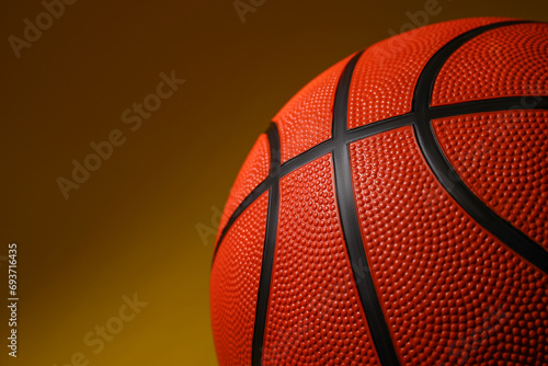 Basketball ball on color background, closeup. Space for text © New Africa