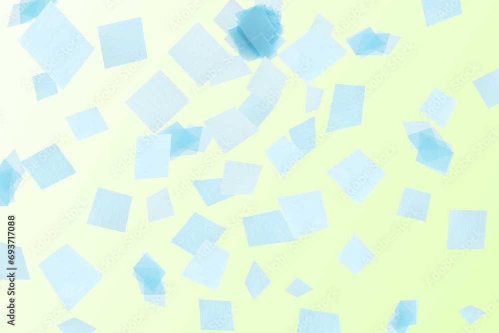 Bright confetti falling on gradient yellow background Bright confetti falling on gradient yellow background