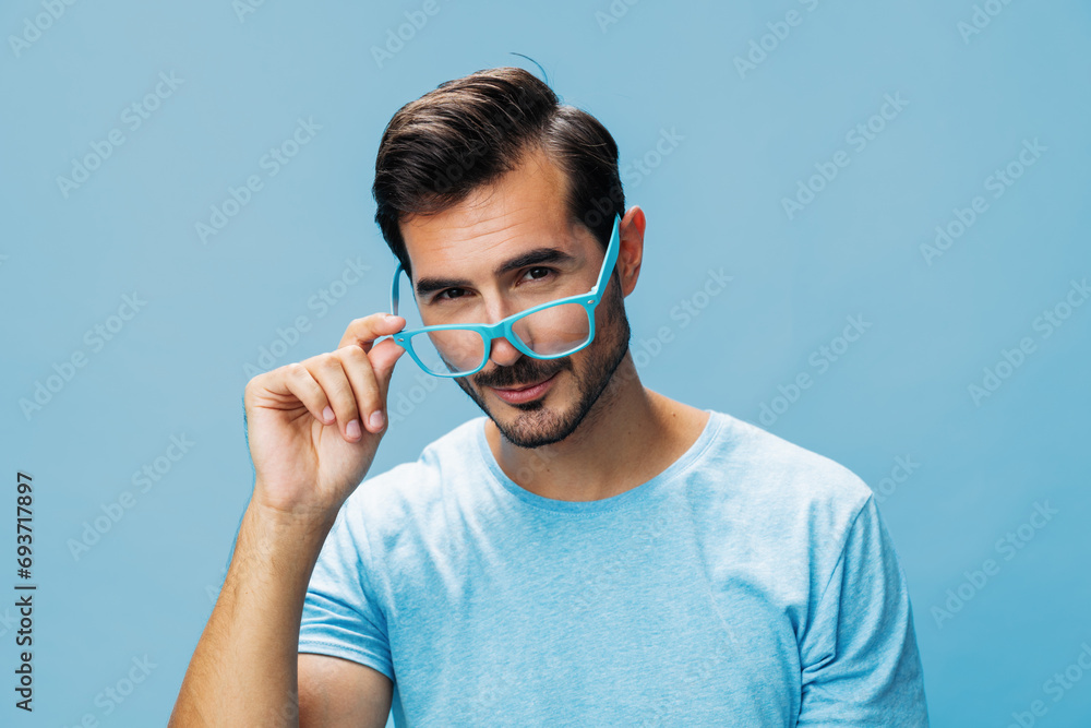 Blue man trendy lifestyle glasses t-shirt fashion portrait modern style beard background smile Blue man trendy lifestyle glasses t-shirt fashion portrait modern style beard background smile