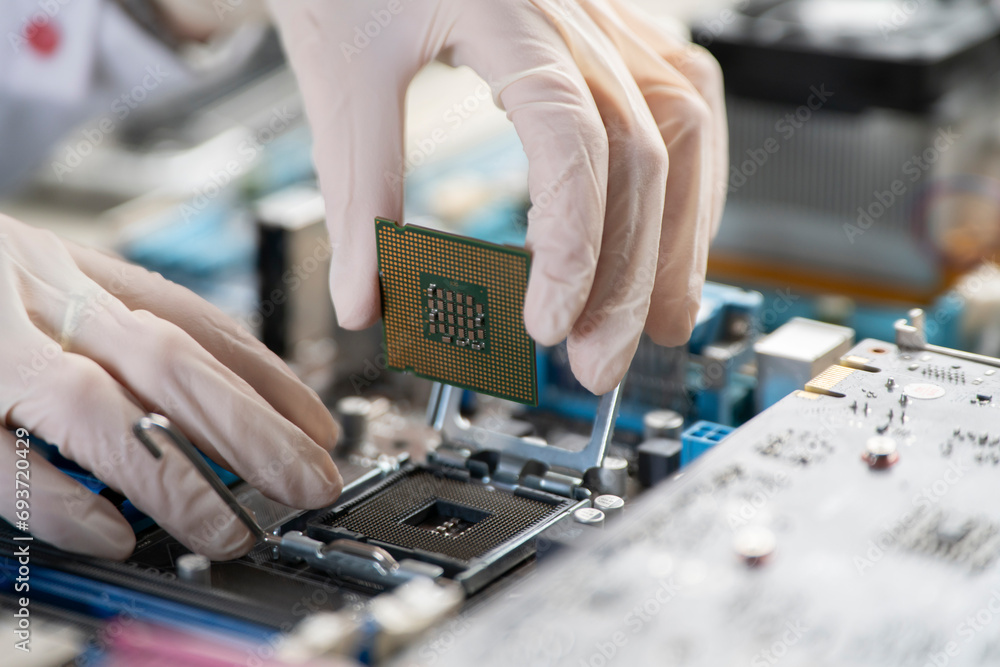 process of Installation of processor in CPU socket, hands in gloves holding chip process of Installation of processor in CPU socket, hands in gloves holding chip