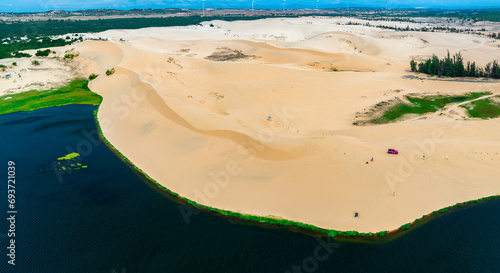 Stark geographical contrast between sand and water near Mui Ne, Vietnam. Mui Ne Desert of Vietnam is a desert in Southeast Asia photo