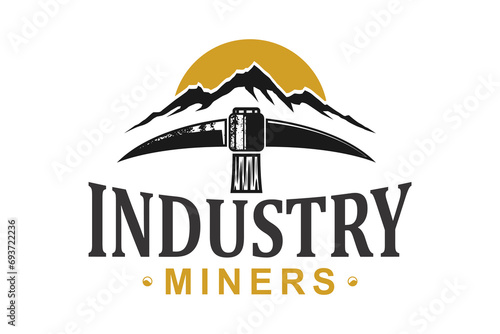 Sunset rocky mountain with pick ax traditional mining tool.