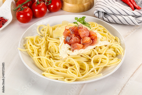 Pasta spaghetti with salmon and stracciatella