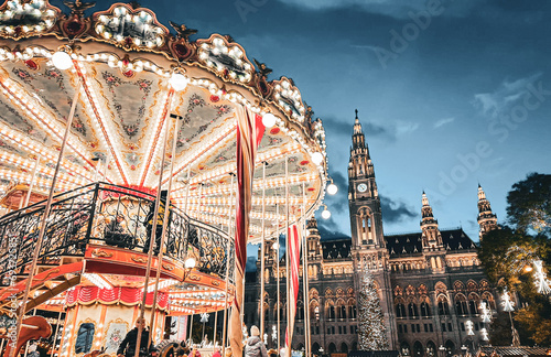 Rathausplatz building and merry go round in Vienna's christmas market