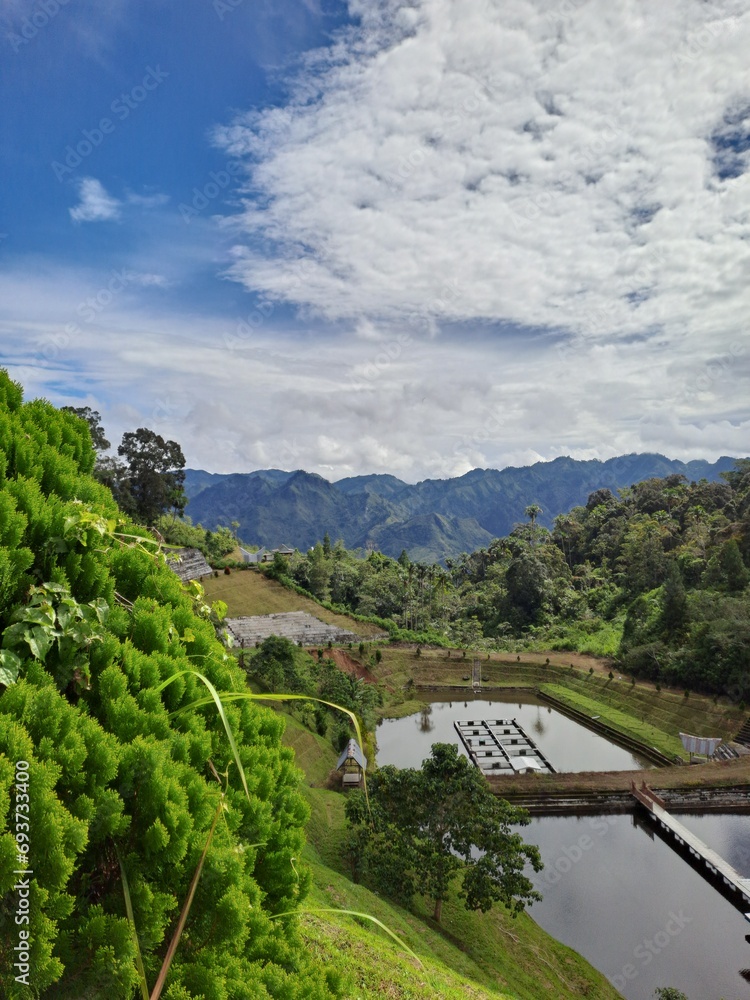 a fish pond on top of the mountains with beautiful views.