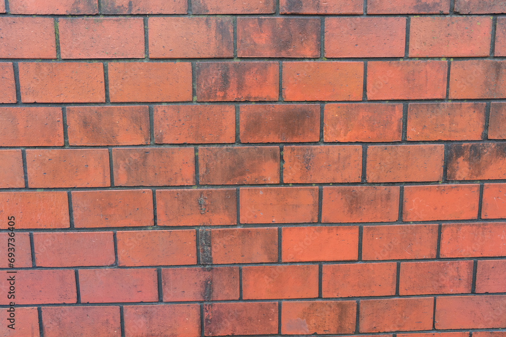 Old brick color stone wall There are natural stains. Close up. Old brick color stone wall There are natural stains. Close up.