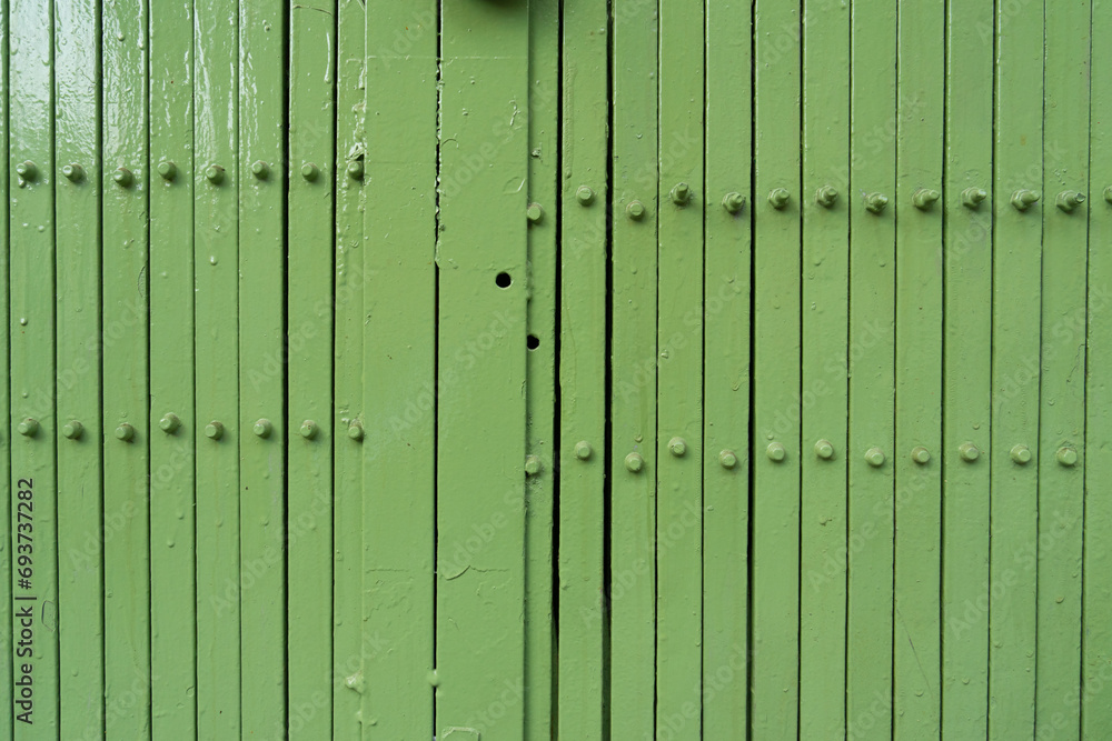 Rebar wall background. Painted green. Abstract wall texture backdrop. Rebar wall background. Painted green. Abstract wall texture backdrop.