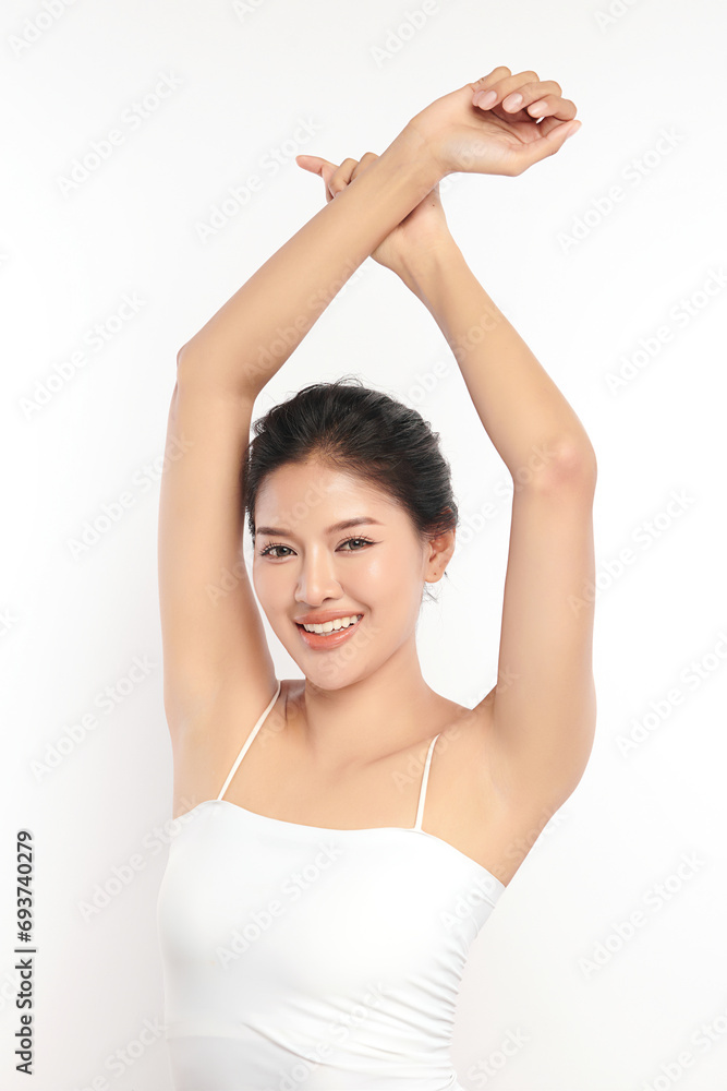 Beautiful Young Asian woman lifting hands up to show off clean and hygienic armpits or underarms on white background, Smooth armpit cleanliness and protection concept Beautiful Young Asian woman lifting hands up to show off clean and hygienic armpits or underarms on white background, Smooth armpit cleanliness and protection concept