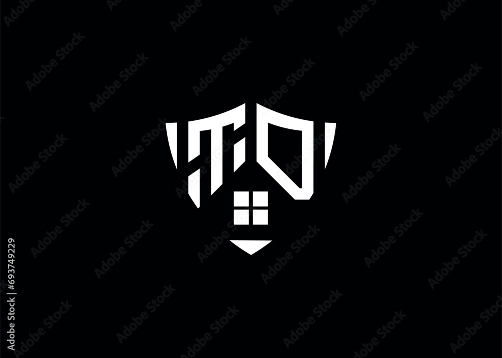 Real estate letter TD shield shape logo and house building vector template Real estate letter TD shield shape logo and house building vector template