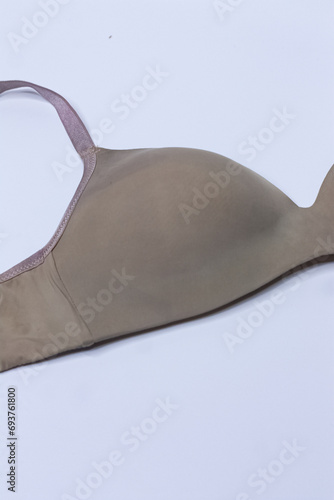 Close-up shot of the modern classic sexy beige seamless smooth unlined luxury elegant women underwire bra. 