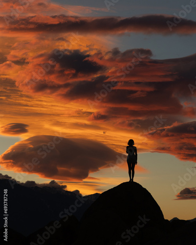silhouette of a girl on the top of mountain