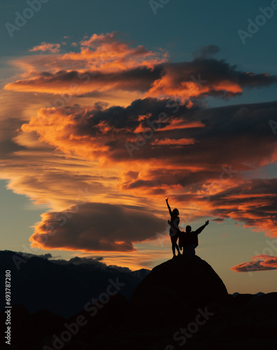 silhouette of a couple on a sunset background