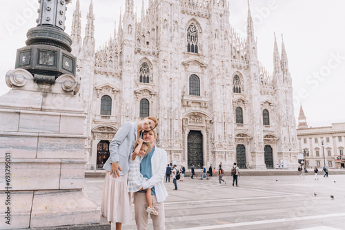 Happy family with a child on the background of the Duomo in Milan © Cavan