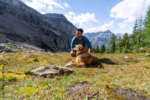 Man And His Best-friend Hiking In Beautiful Mountain Landscape © Cavan
