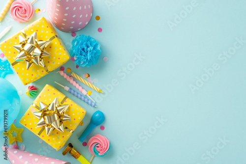 Lively party inspiration theme. Flat lay top view image featuring celebratory props, lollipops, gift boxes, party hats, blower, candles, confetti against light blue background, leaving space for text