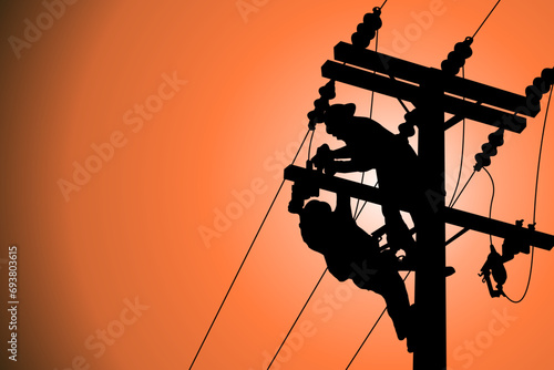 The silhouette of power lineman climbing on an electric pole with a transformer installed. And replacing the damaged hotline clamp, bail clamp, dropout and surge arrester that causes a power failure.