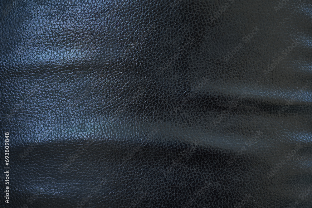 Fototapeta premium Black background. Leather car seat covers and sofas.