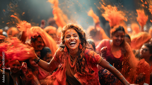 Vibrant Holi Celebration in India: Indian girl amidst a cloud of colored powder joyfully enjoying with crowds of people.