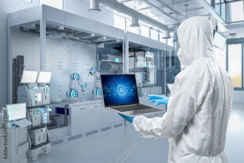 Worker or engineer wears protective suit work in semiconductor manufacturing factory photo