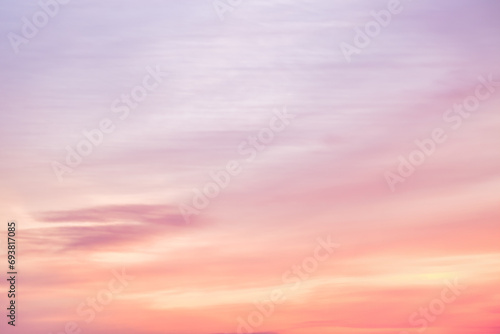 A beautiful sky tinted by the sun leaving vibrant shades of gold, pink, blue and multicolored. Clouds in the twilight evening and morning sky. Image of a cloudy sky in the evening and during the day