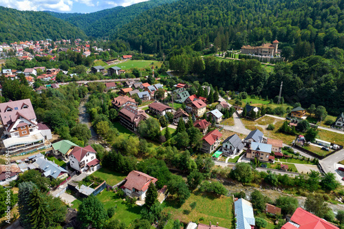 Aerial view over the town of Bușteni in Romania, with the Cantacuzino Castle’s domain in the background. Bușteni is located in the Prahova Valley, at the foot of the Bucegi Mountains.