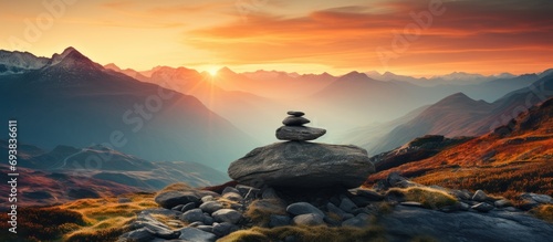 Serenity in mountain landscape with stones and silhouette of ridge on sunset in highlands valley, closeup, vertical.