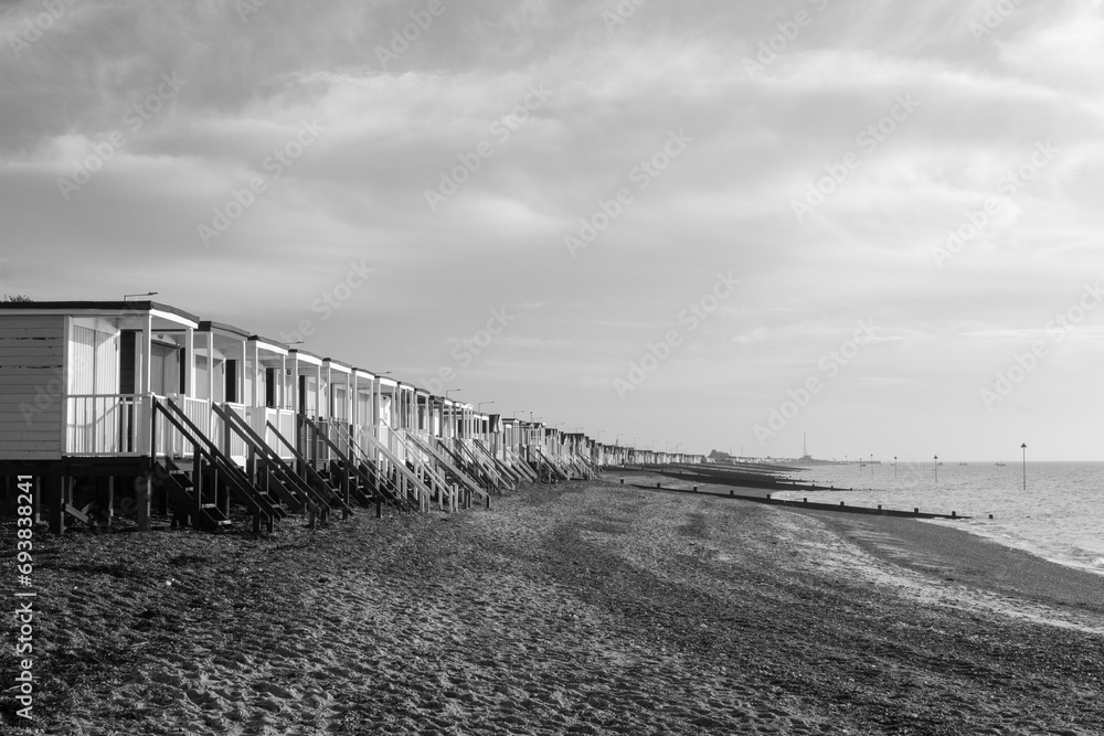 Black and white image of the beach huts at Thorpe Bay, Essex, England, United Kingdom