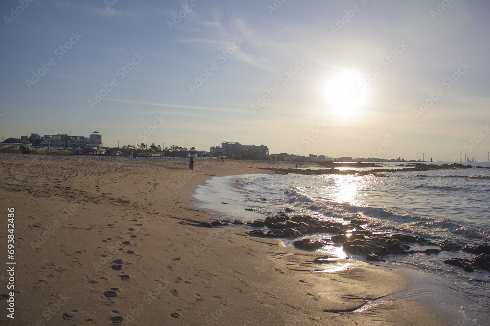 
It is a beach where the sun is shining.