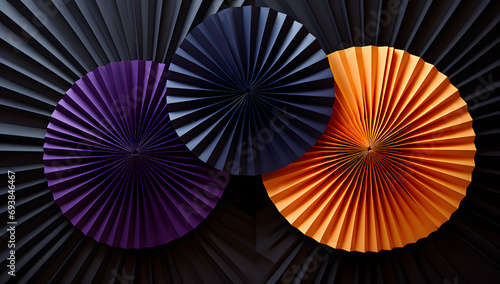 colorful paper fans on a black background photo
