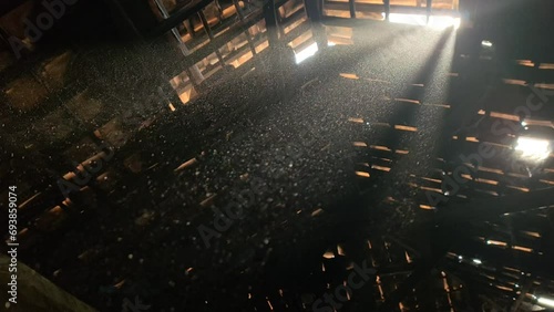 Dust particles are clearly visible to sunlight inside the warehouse
