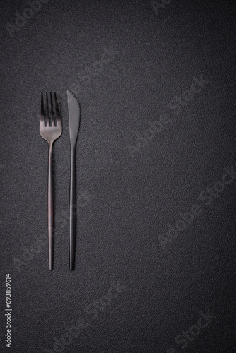 Kitchen knife and fork made of steel with copy space