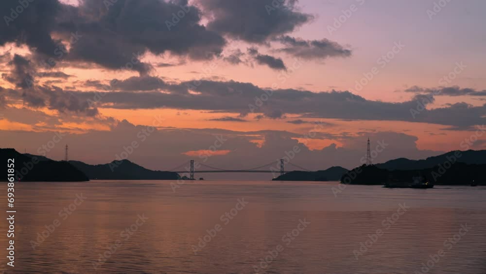Timelapse of Seto Ohashi Bridge in the morning sun in Onomichi City, Hiroshima prefecture in Japan Timelapse of Seto Ohashi Bridge in the morning sun in Onomichi City, Hiroshima prefecture in Japan