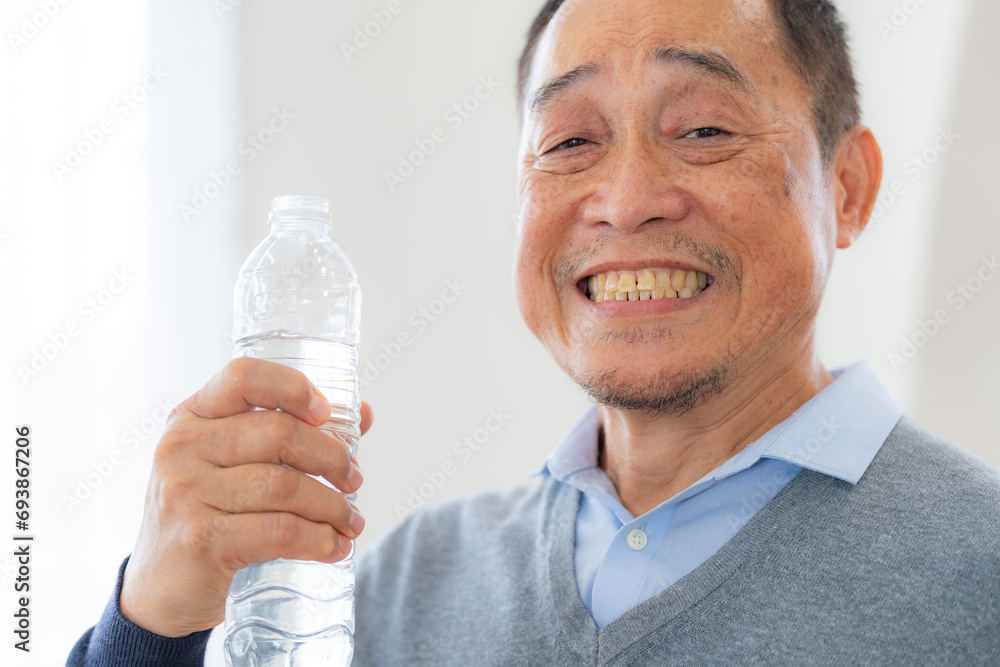 Happiness of male elderly holding a bottle of water. Senior people drinking fresh mineral water. Happiness of male elderly holding a bottle of water. Senior people drinking fresh mineral water.