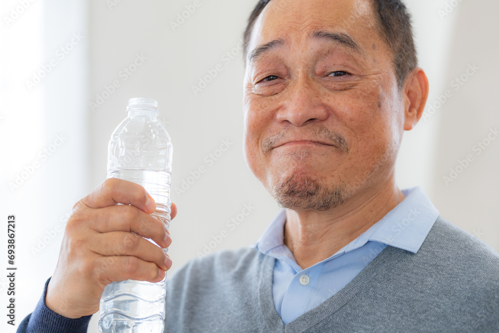 Happiness of male elderly holding a bottle of water. Senior people drinking fresh mineral water. Happiness of male elderly holding a bottle of water. Senior people drinking fresh mineral water.